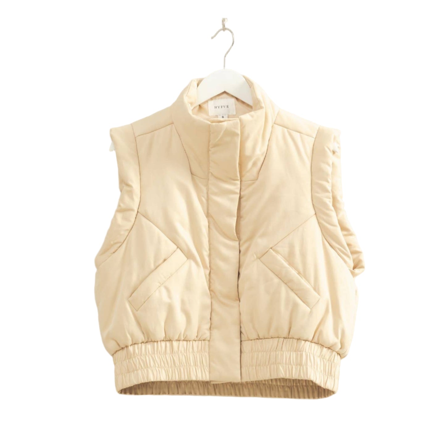 Beige puffer vest on a hanger against a plain background