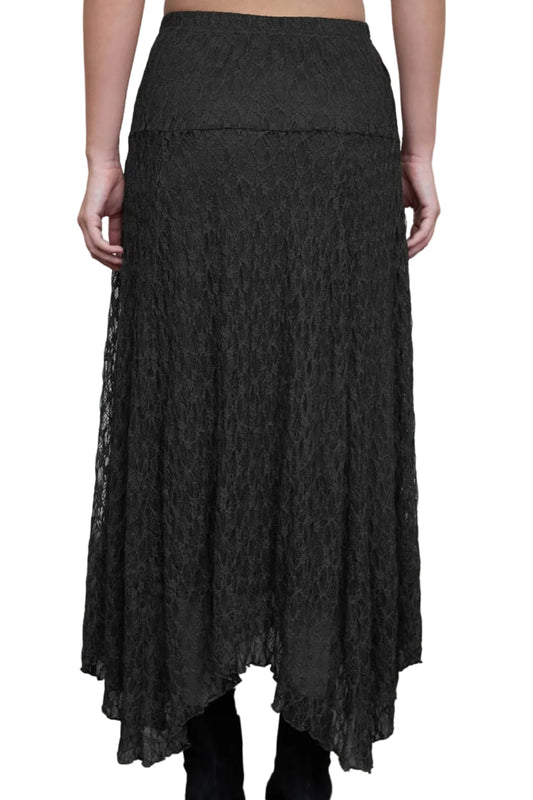 A black lace midi skirt with a tiered design and asymmetrical hem, shown on a model from the back against a neutral studio backdrop.