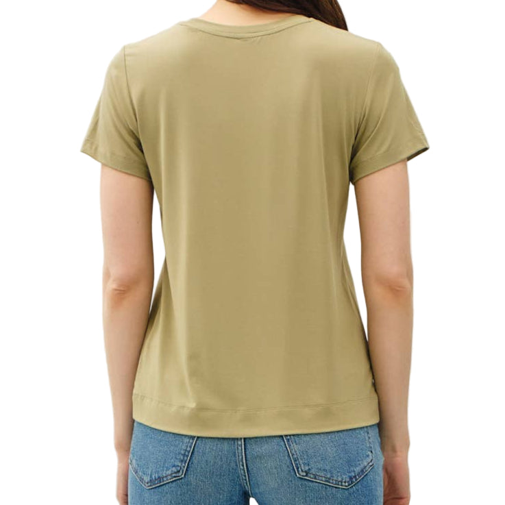 Person wearing a green t-shirt and blue jeans on a white background