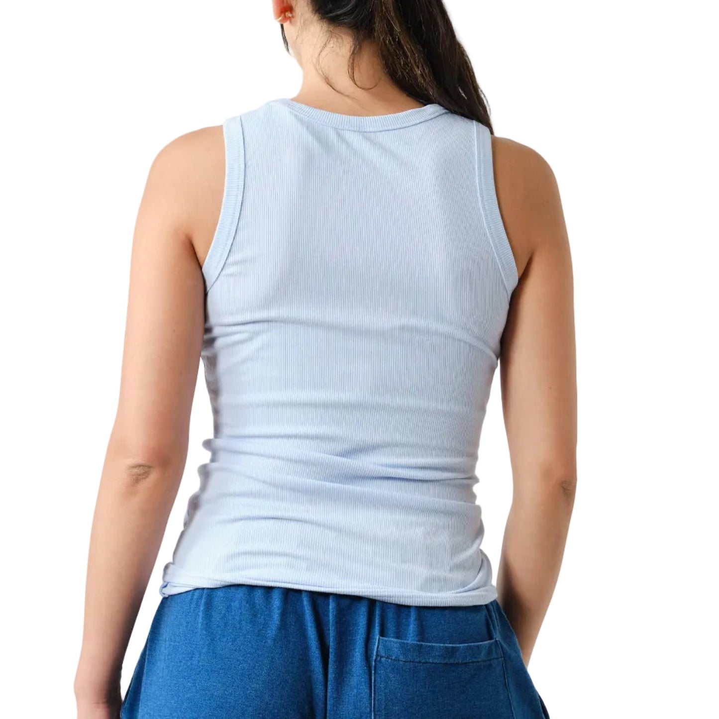 Person wearing a light blue sleeveless top and blue pants on a white background