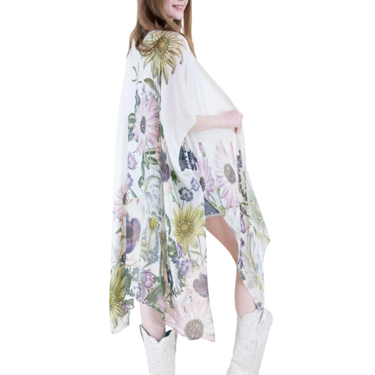 Woman wearing a floral dress with a high-low hem and white boots on a white background