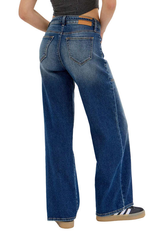 Person wearing blue jeans on a white background