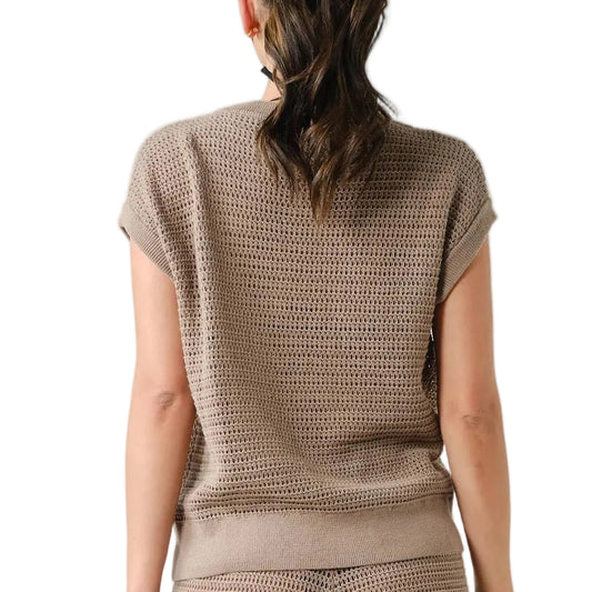 Woman wearing a brown knit outfit on a white background