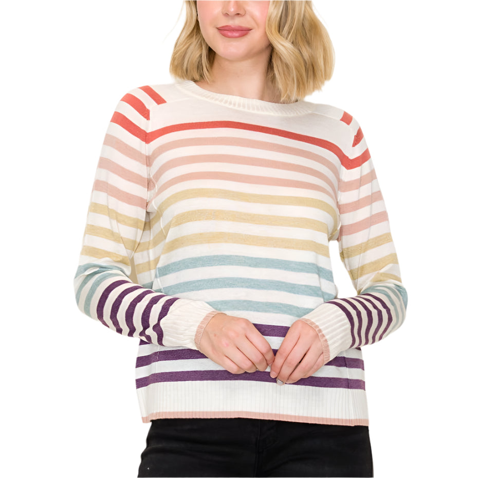 Woman wearing a multicolored striped sweater against a white background