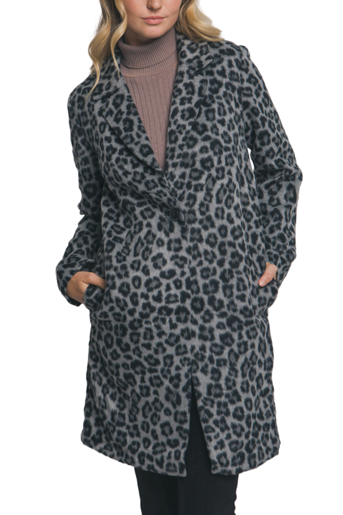 Woman wearing a leopard print coat against a plain background