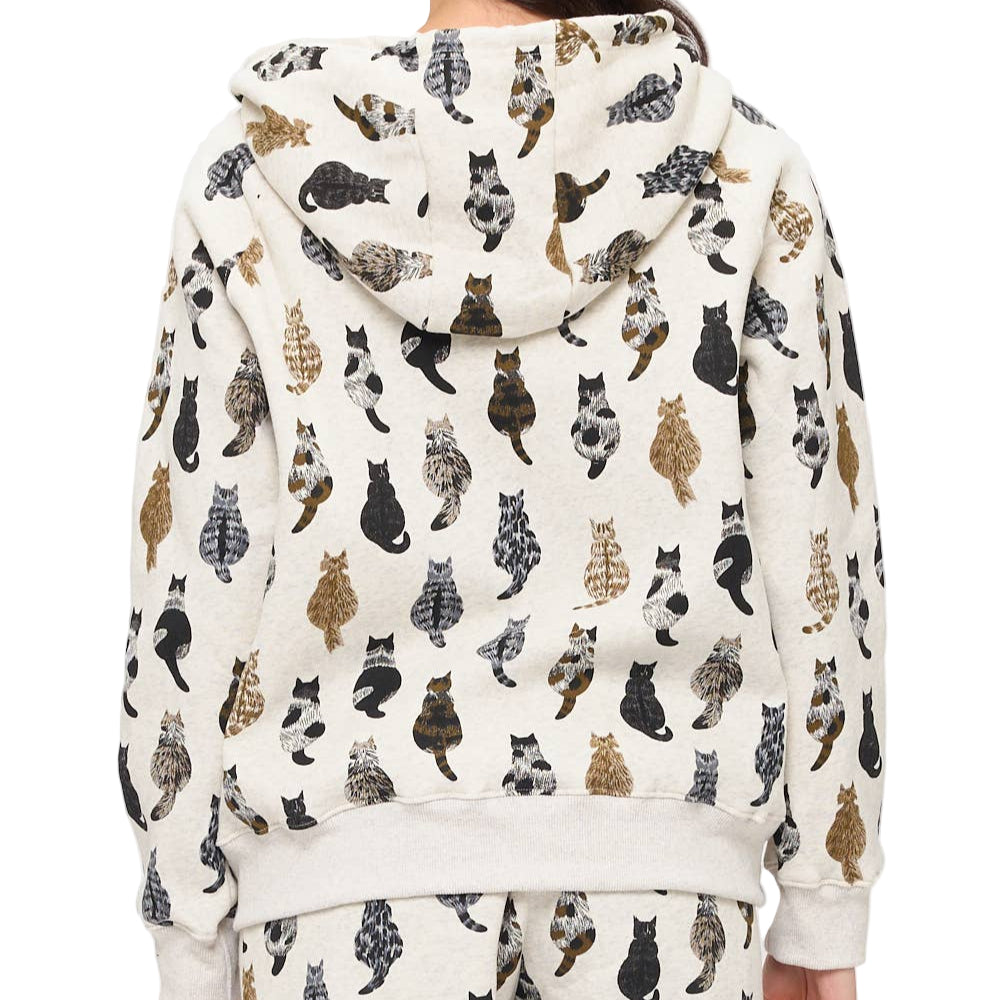 Person wearing a hoodie with a cat pattern on a white background