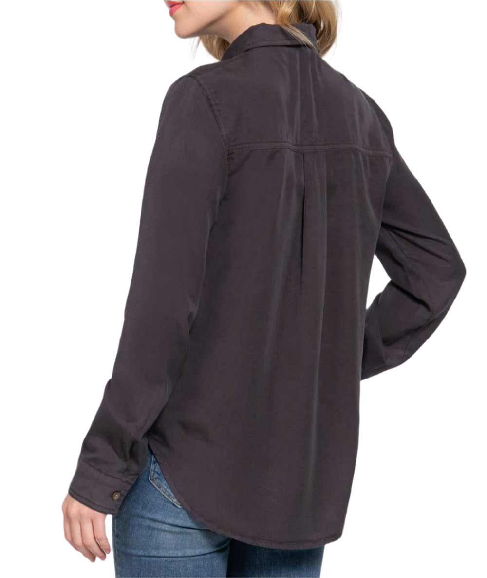 Woman wearing a dark gray shirt and blue jeans on a white background