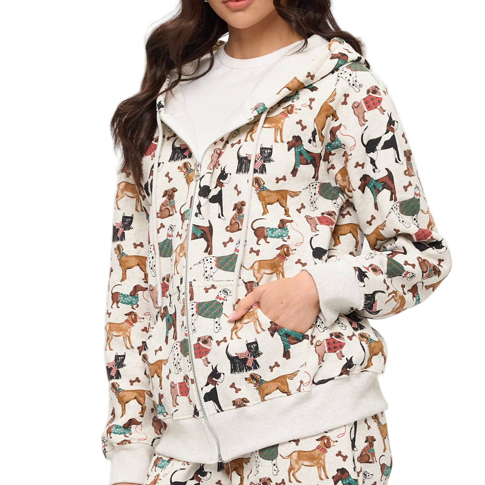 Woman wearing a hoodie with dog pattern on a plain background