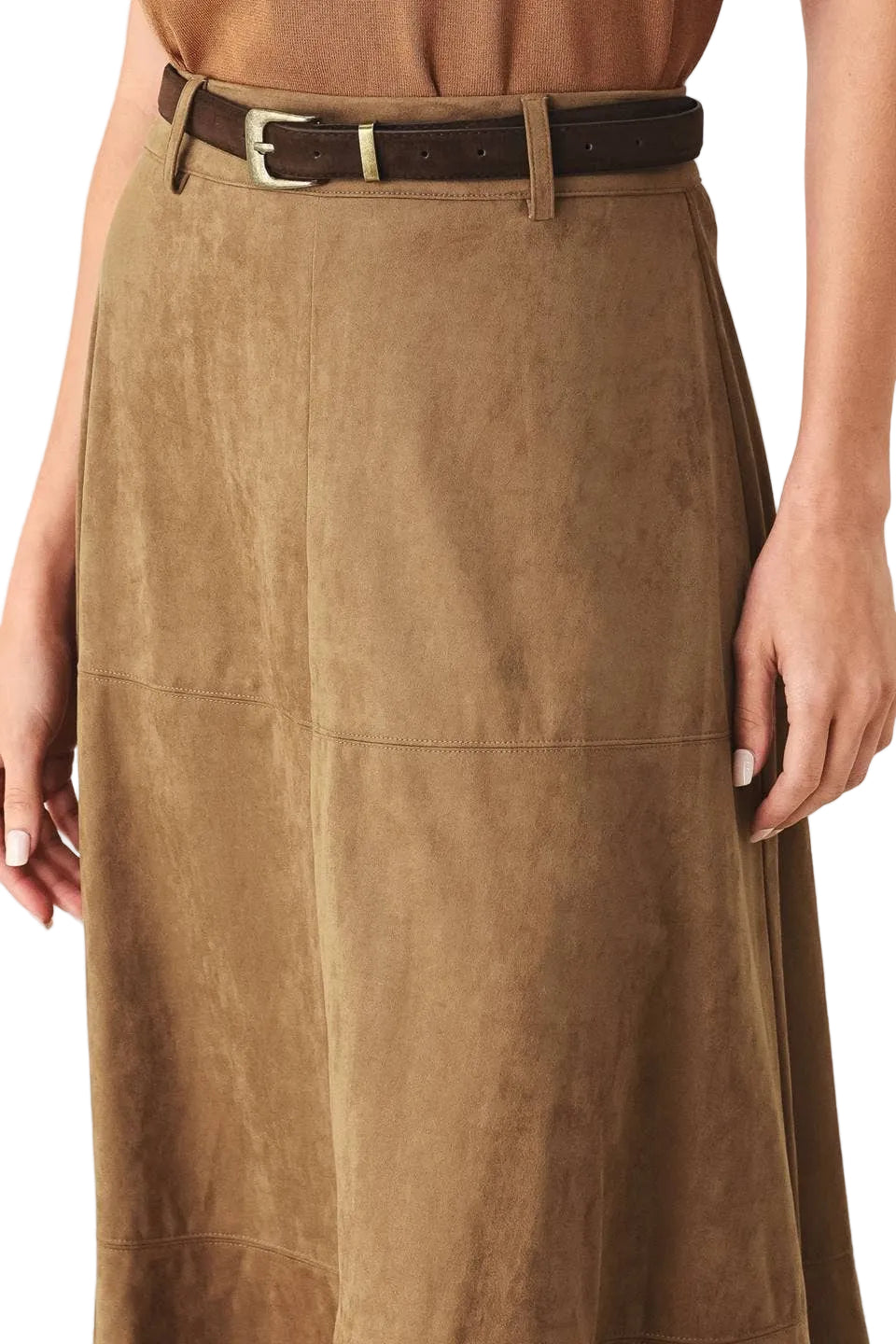 A close-up of a person wearing a brown suede or faux-suede skirt with a dark brown belt featuring a gold-tone buckle. The model's hands and torso are visible against a plain light background.