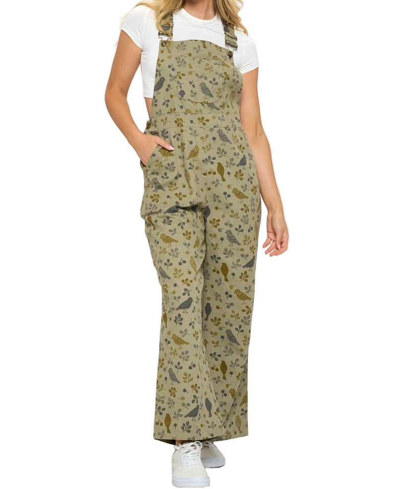 Woman wearing a floral patterned overalls on a white background