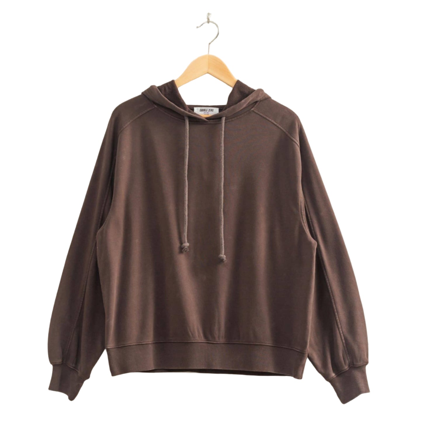 Brown hoodie on a hanger against a plain wall