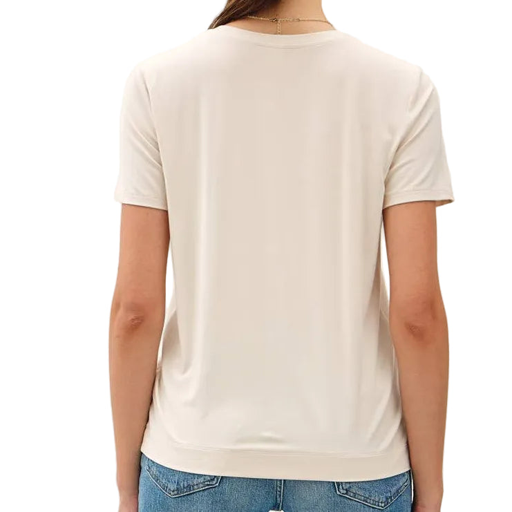 Person wearing a white t-shirt and blue jeans on a white background