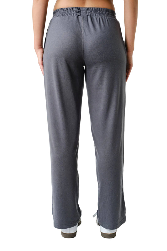 Person wearing gray pants on a white background