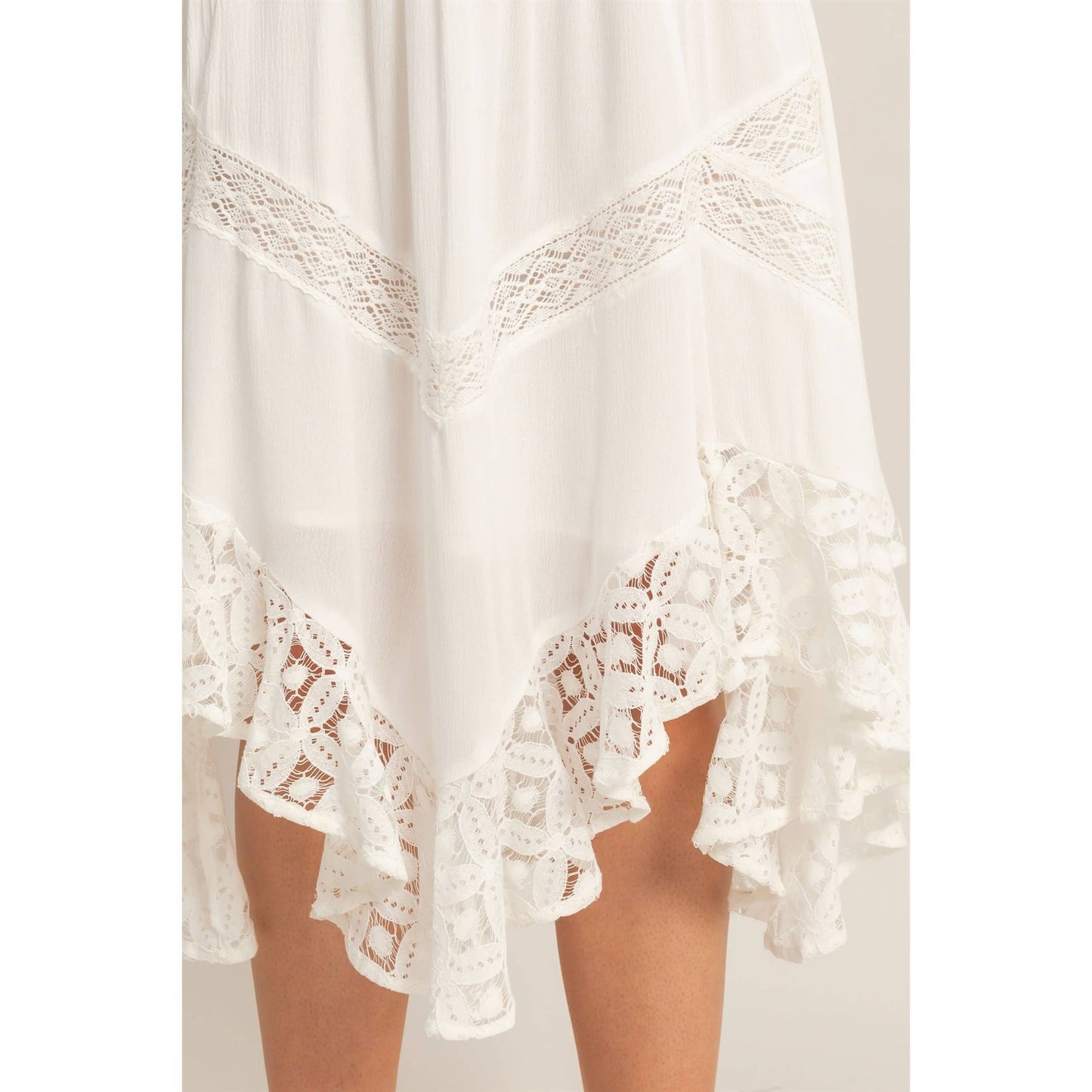 White lace garment on a plain background