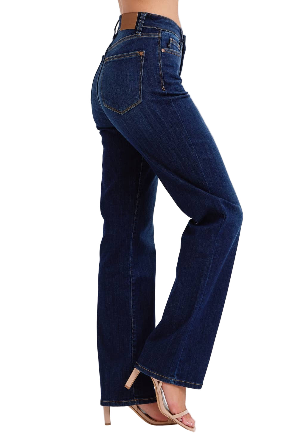 Blue jeans worn by a person on a white background