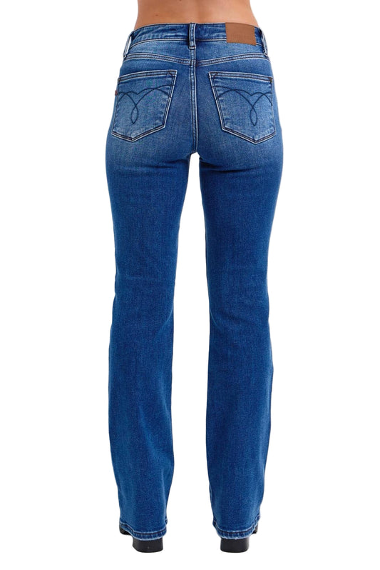 Blue jeans shown from the back on a white background