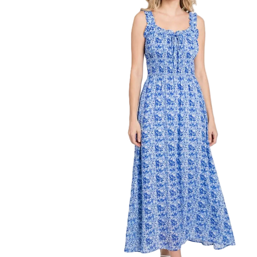 Woman wearing a blue floral dress on a white background
