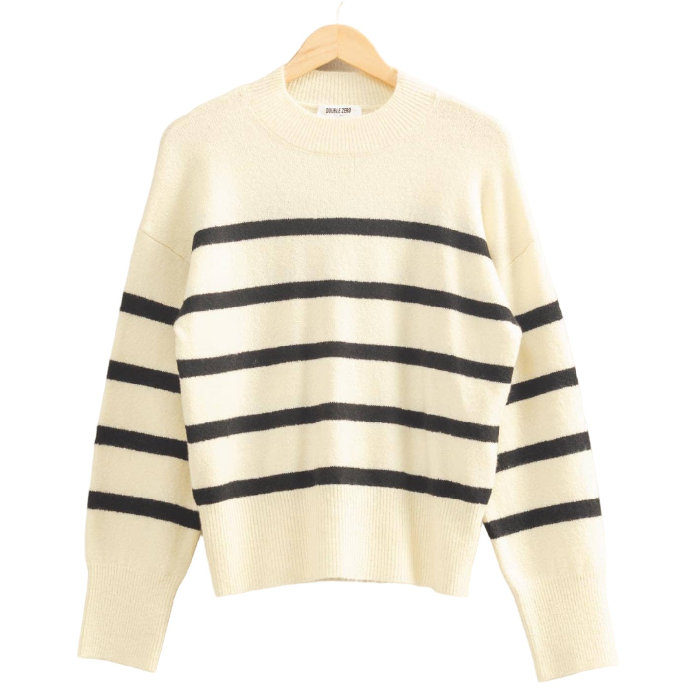 Cream-colored sweater with black stripes on a hanger against a light gray background