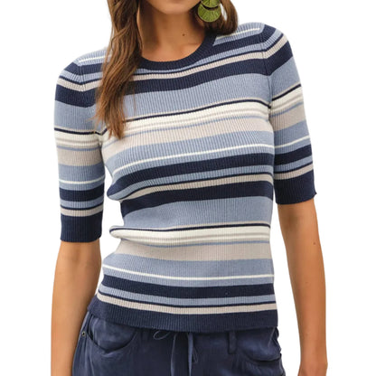Woman wearing a striped sweater with a plain background