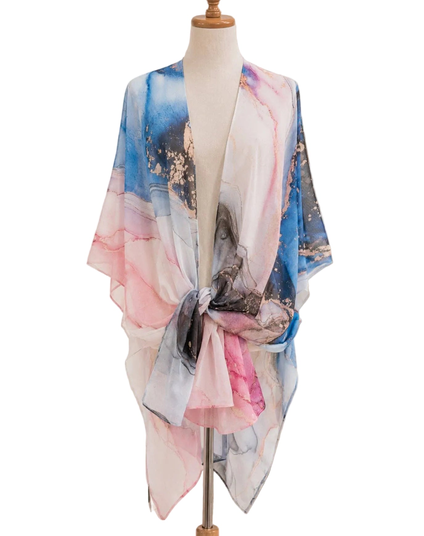 Colorful scarf on a mannequin in a home setting with decor elements.