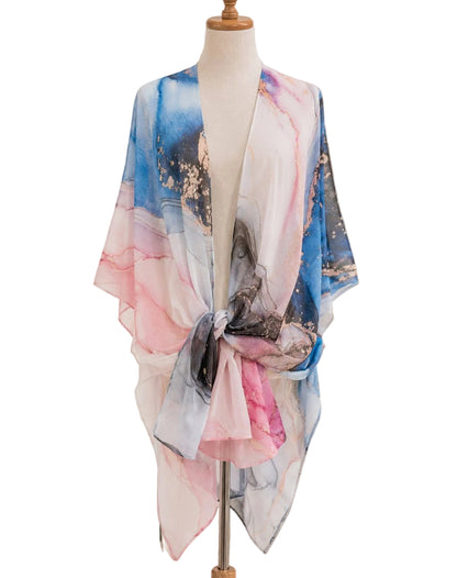 Colorful scarf on a mannequin in a home setting with decor elements.