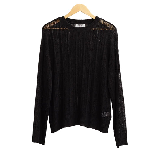 Black long-sleeve top on a hanger against a light gray background