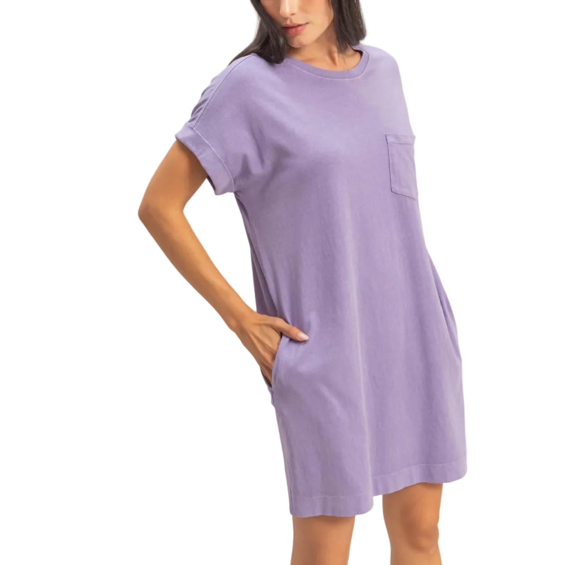 Woman wearing a purple dress against a plain background