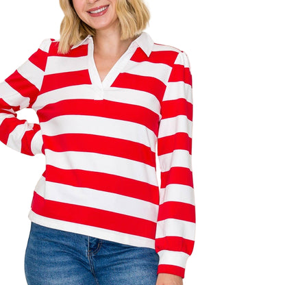 Woman wearing a red and white striped shirt with a plain background