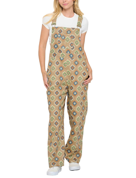 Woman wearing patterned overalls on a white background