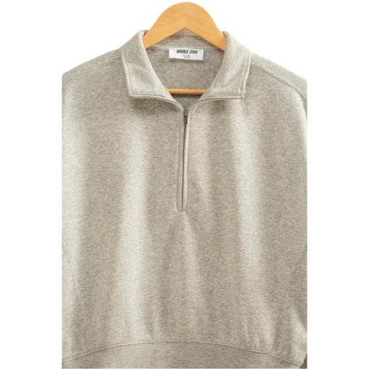Gray half-zip sweatshirt on a wooden hanger against a light gray background