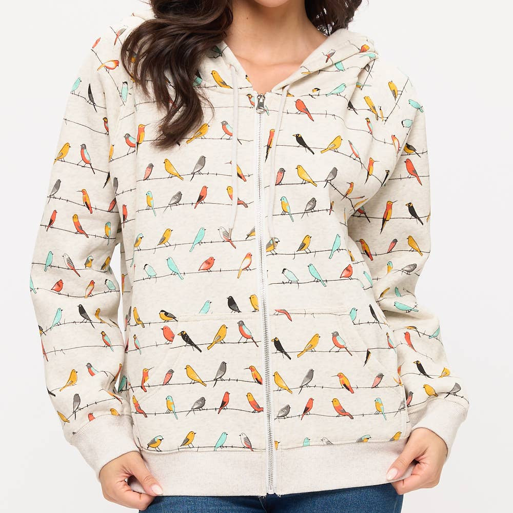 Woman wearing a jacket with bird pattern on a white background