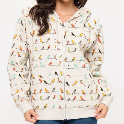 Woman wearing a jacket with bird pattern on a white background