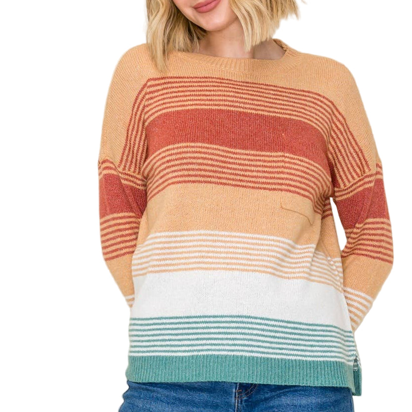 Woman wearing a striped sweater with a plain background