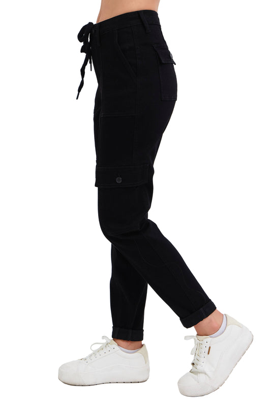 Black cargo pants worn by a person on a white background