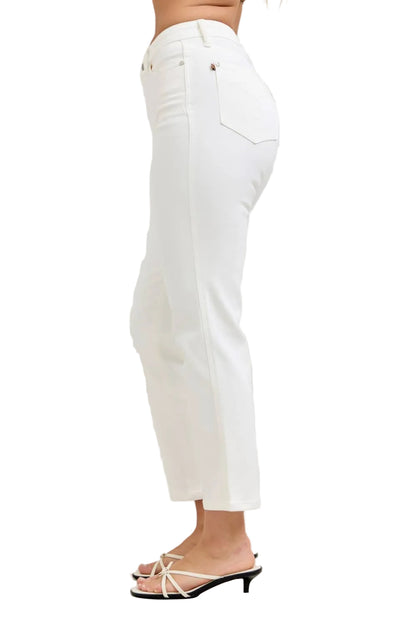 White pants worn by a person on a white background