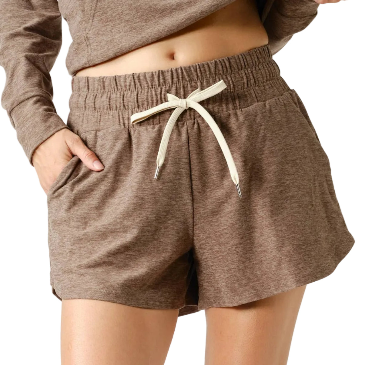 Person wearing brown shorts with a drawstring on a white background
