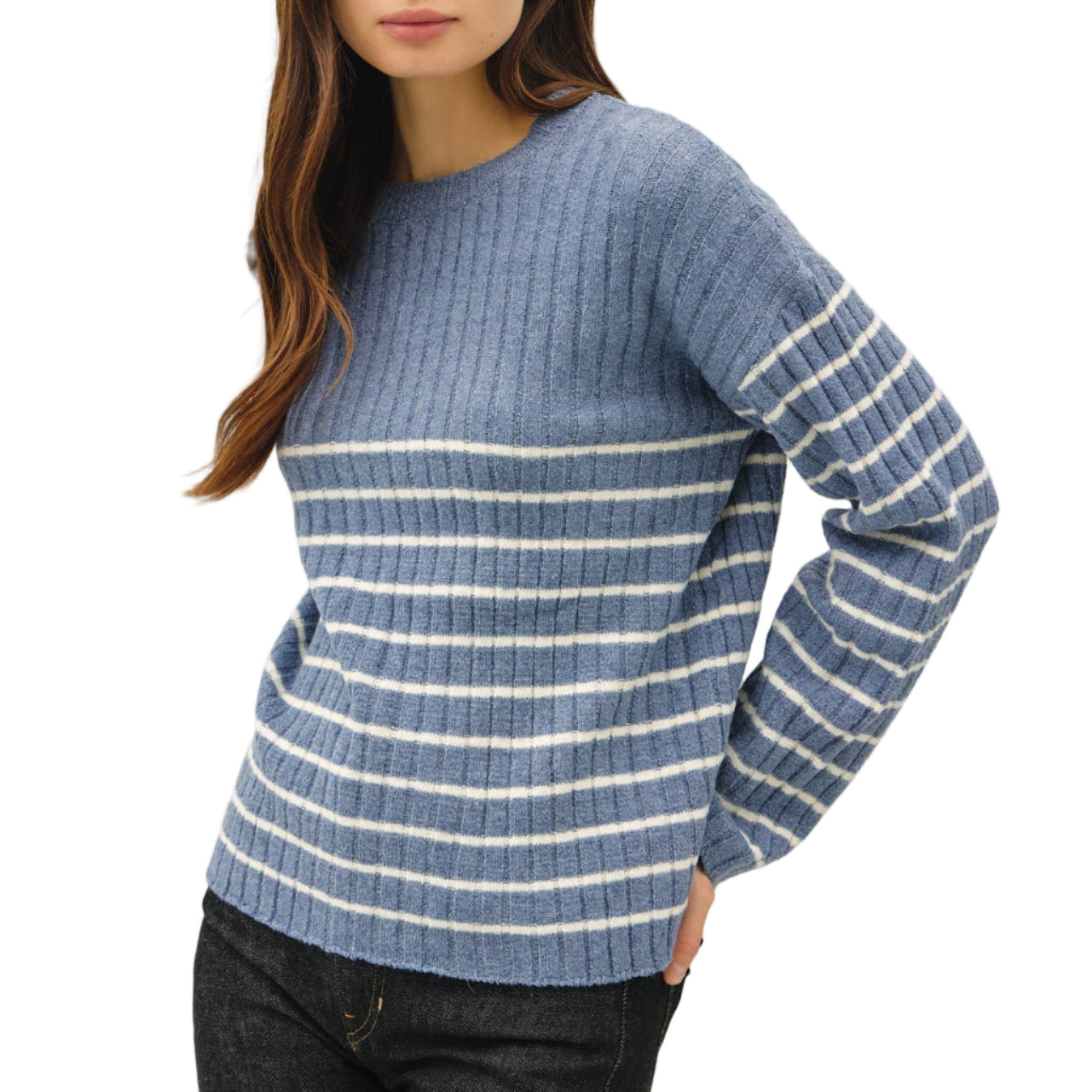 Woman wearing a blue and white striped sweater on a plain background