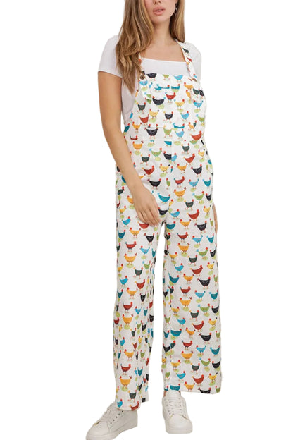 Woman wearing a colorful patterned overalls in a room with plants.