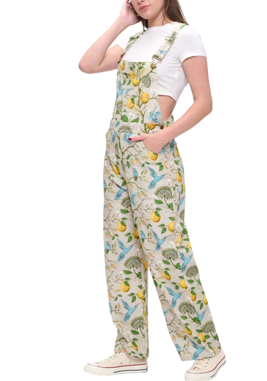 Person wearing a patterned jumpsuit on a white background
