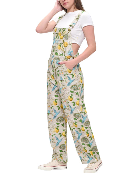 Person wearing a patterned jumpsuit on a white background
