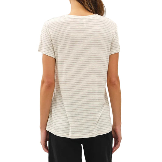 Woman wearing a white striped shirt and black pants on a white background