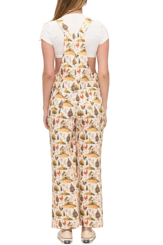 Woman wearing a patterned overalls on a white background