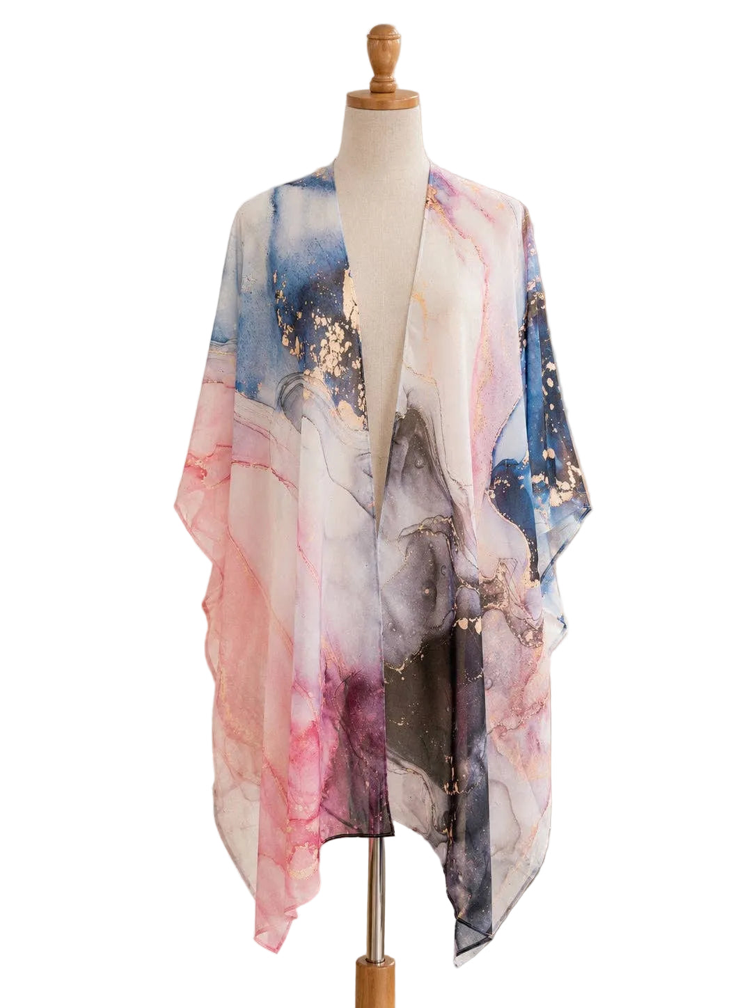 Mannequin wearing a colorful scarf in a home decor setting with plants and shelves.