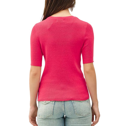 Person wearing a pink top and light blue jeans on a white background