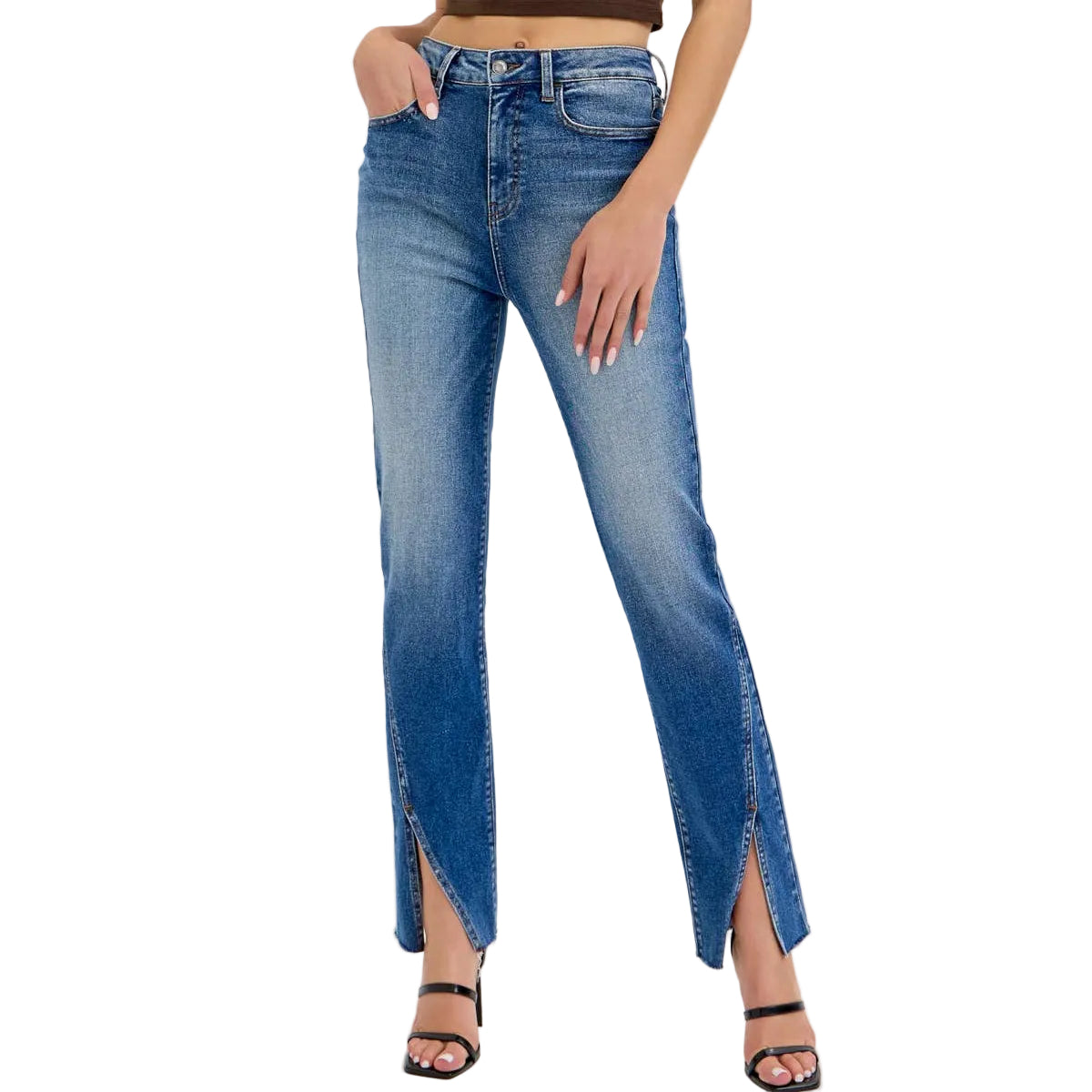Woman wearing a brown crop top and blue jeans with a slit on a white background