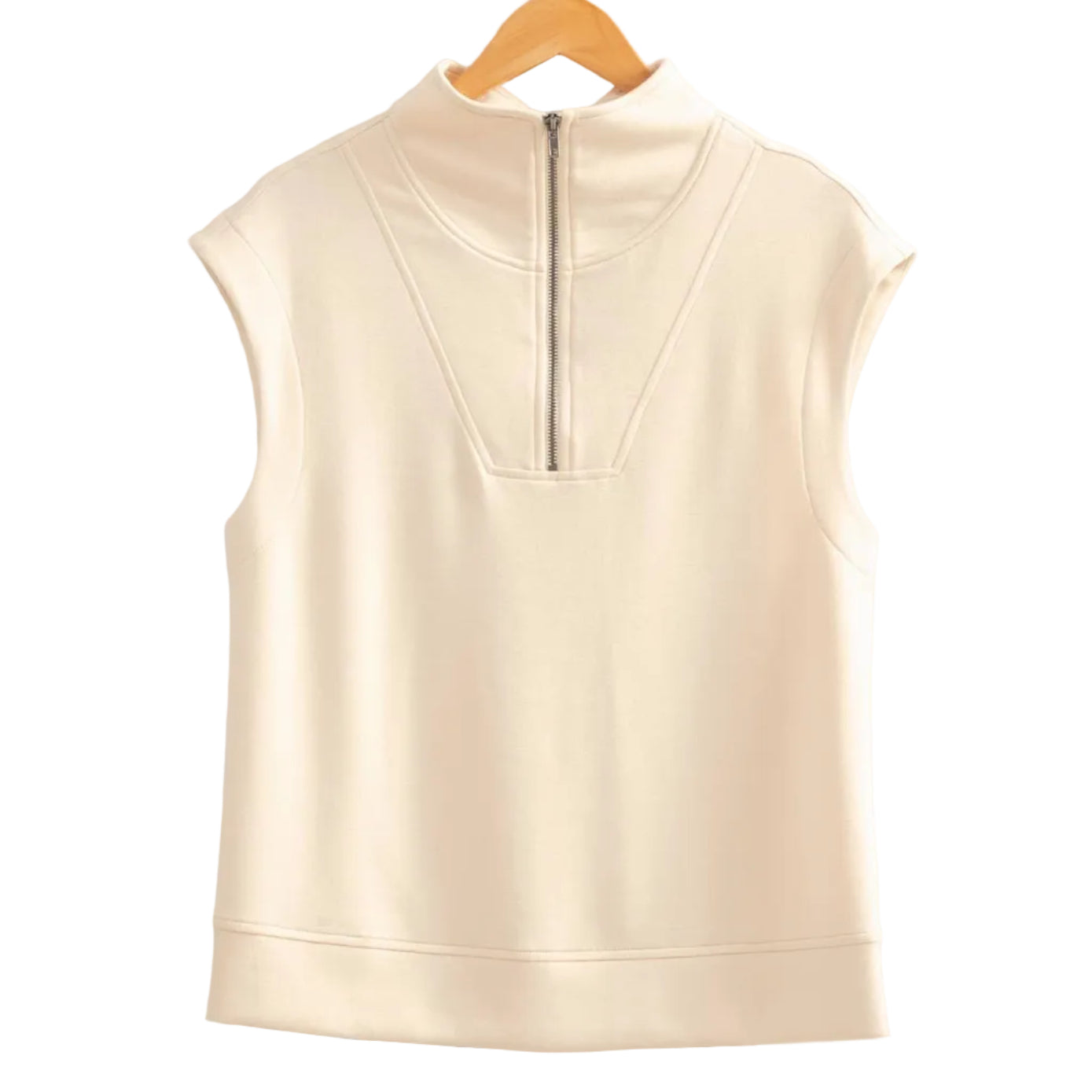 Beige sleeveless top on a wooden hanger against a beige wall