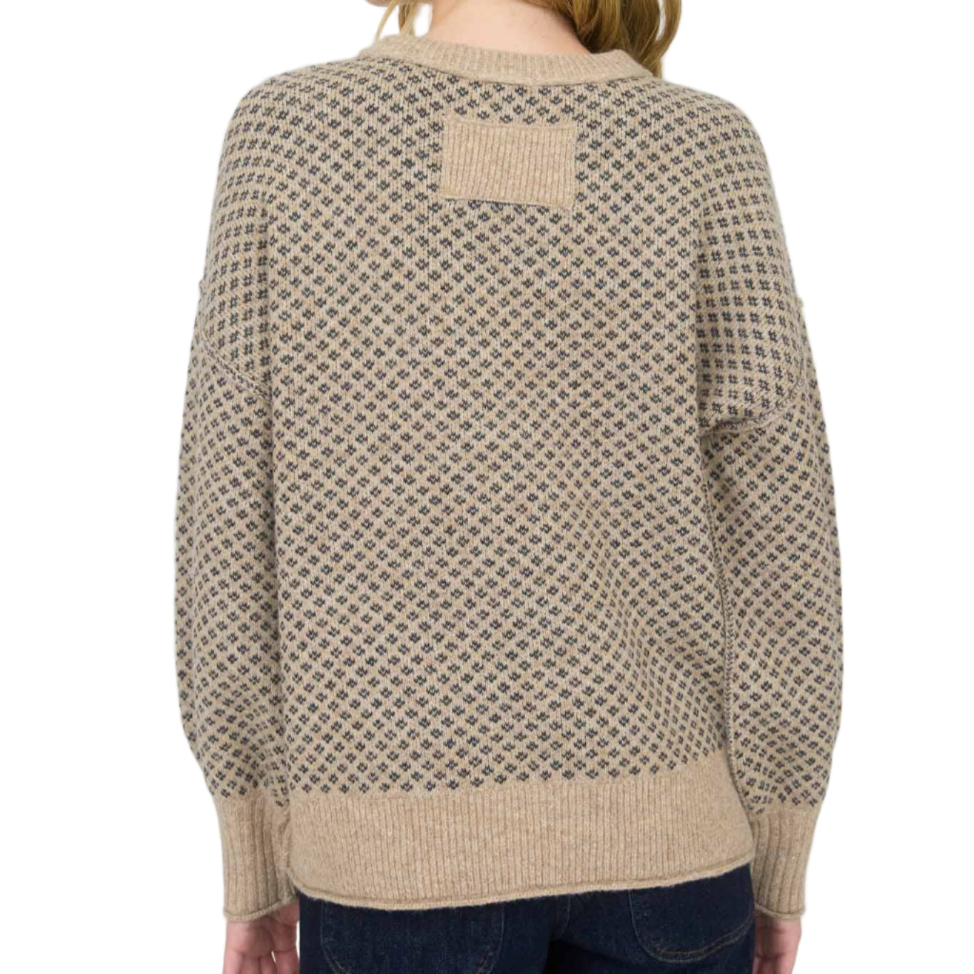 Woman wearing a patterned sweater on a white background