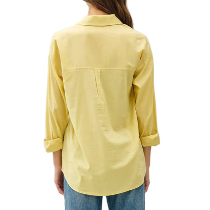 Person wearing a yellow shirt and blue jeans on a white background