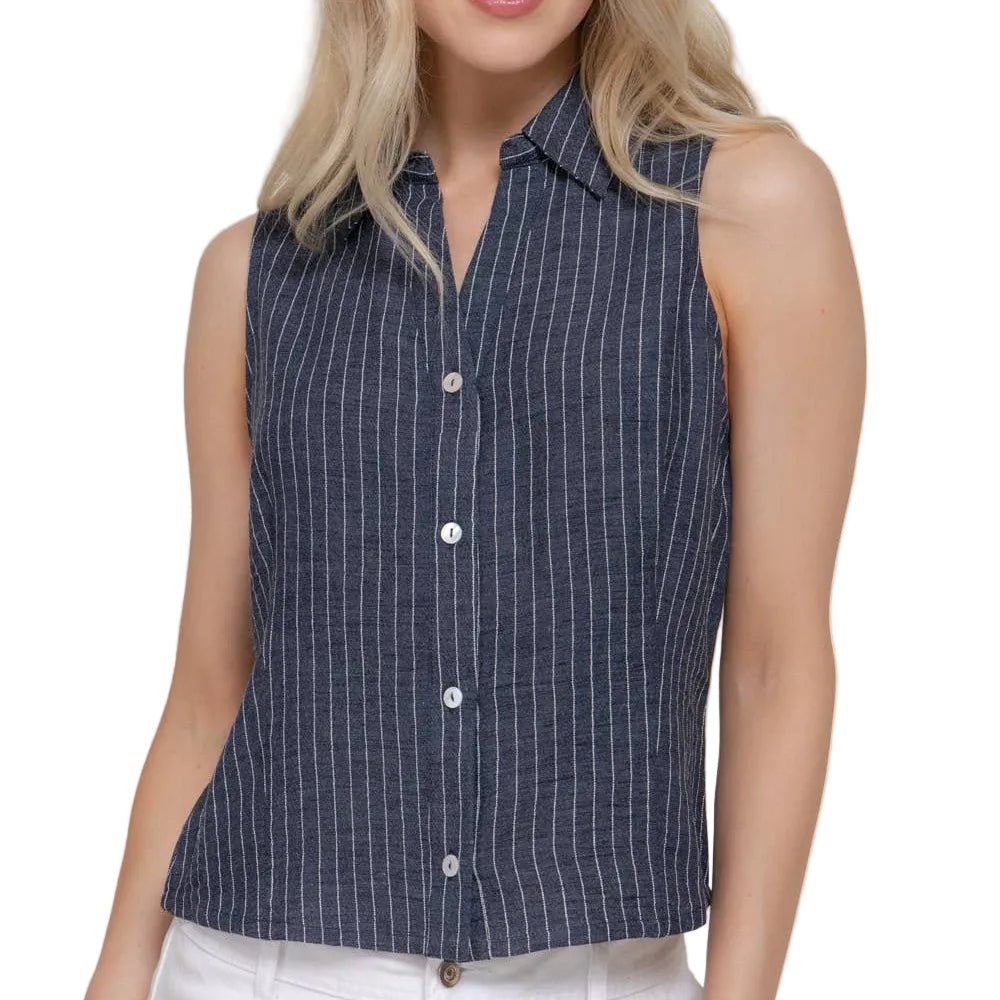 Woman wearing a sleeveless striped shirt against a plain background