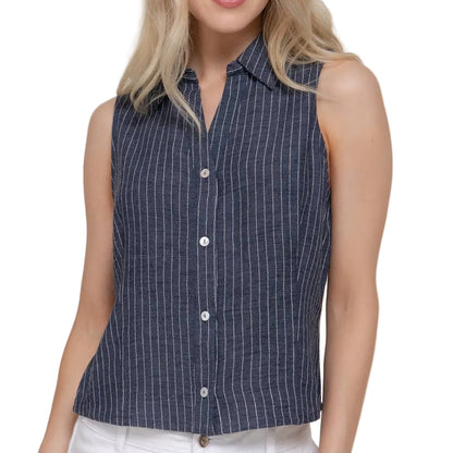 Woman wearing a sleeveless striped shirt against a plain background